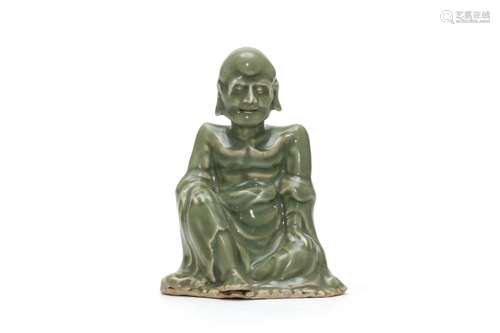 A Green Glazed Luohan Figure