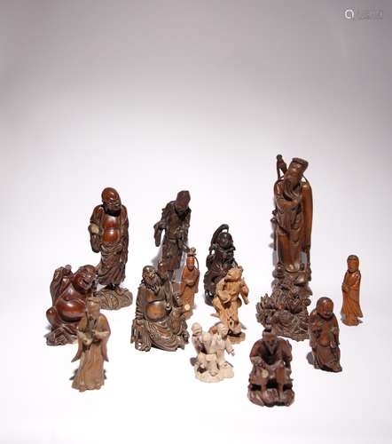 FOURTEEN CHINESE CARVED HARDWOOD AND BAMBOO FIGURES LATE QIN...