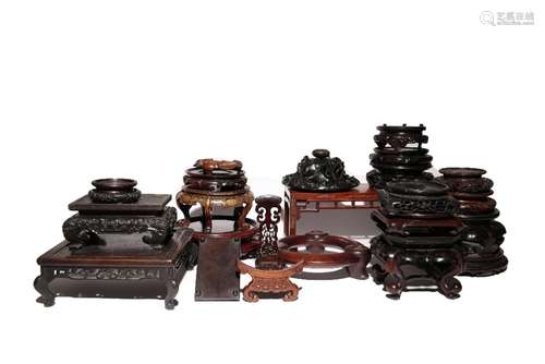 A COLLECTION OF CHINESE WOOD STANDS AND A COVER 19TH AND 20T...