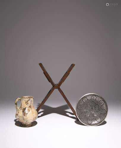 AN EARLY ISLAMIC POTTERY MUG, A WOOD QURAN STAND AND A SILVE...