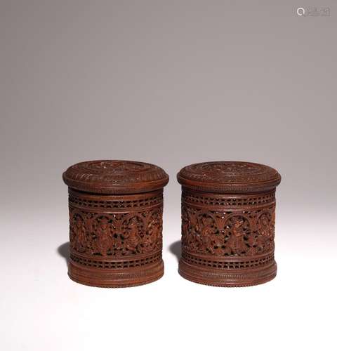 A PAIR OF INDIAN SANDALWOOD CYLINDRICAL BOXES AND COVERS LAT...