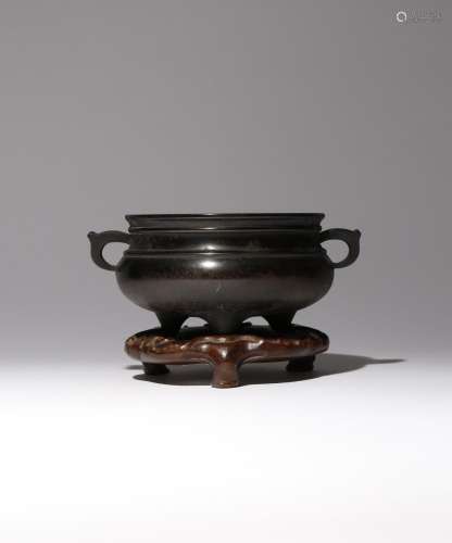 A CHINESE BRONZE TRIPOD INCENSE BURNER QING DYNASTY OR LATER...
