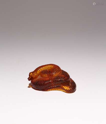 A CHINESE RECONSTITUTED AMBER MODEL OF A SNAKE PROBABLY REPU...