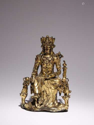A CHINESE LACQUERED AND GILT-BRONZE FIGURE OF GUANYIN LATE M...
