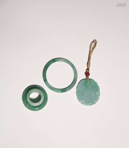 FOUR CHINESE JADEITE ITEMS QING DYNASTY OR LATER Comprising:...