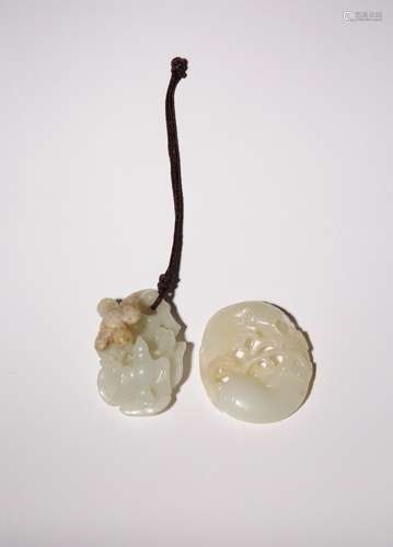 TWO CHINESE PALE CELADON JADE PENDANTS QING DYNASTY OR LATER...