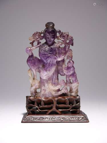 A CHINESE AMETHYST CARVING OF MAGU QING DYNASTY Standing, we...