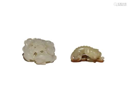 A CHINESE YELLOW JADE CARVING OF A RECUMBENT HOUND AND A WHI...