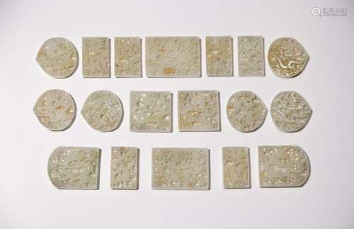 A SET OF EIGHTEEN CHINESE PALE CELADON JADE RETICULATED BELT...