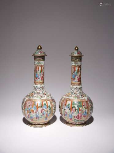 A PAIR OF CHINESE CANTON FAMILLE ROSE FIGURAL BOTTLE VASES A...