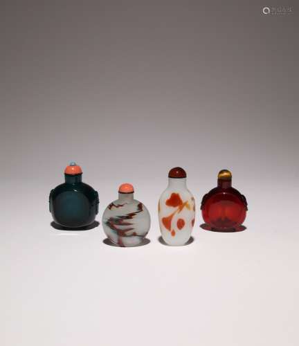 FOUR CHINESE GLASS SNUFF BOTTLES 19TH CENTURY One in ruby co...