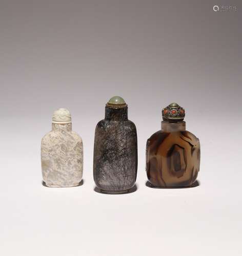 THREE CHINESE HARDSTONE SNUFF BOTTLES One hair crystal, the ...