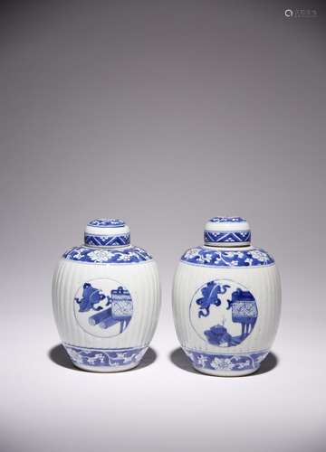 A NEAR PAIR OF CHINESE BLUE AND WHITE OVOID JARS AND COVERS ...