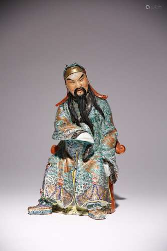 A CHINESE POLYCHROME FIGURE OF GUANDI 20TH CENTURY Seated on...