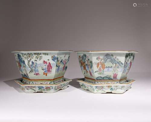 A PAIR OF CHINESE FAMILLE ROSE HEXAGONAL JARDINIERES AND STA...