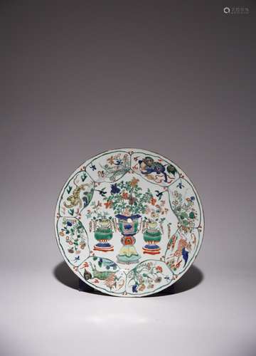 A CHINESE FAMILLE VERTE HUNDRED ANTIQUES DISH FROM THE COLLE...