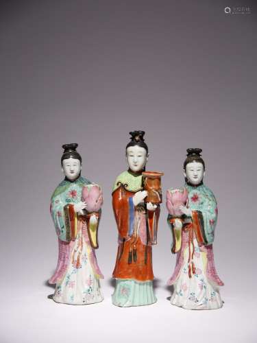 THREE CHINESE FAMILLE ROSE CANDLESTICK FIGURES OF COURT LADI...