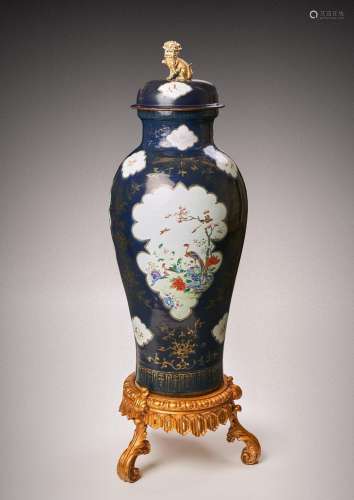 A MASSIVE CHINESE FAMILLE ROSE BLUE-GROUND BALUSTER VASE AND...