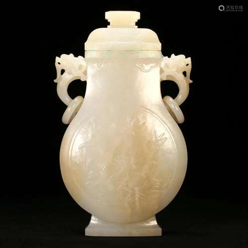 A WHITE JADE VASE WITH HANDLES