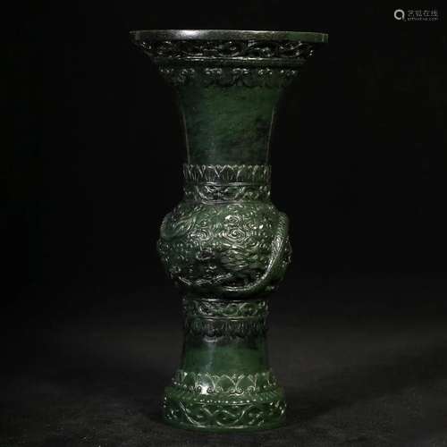 A SPINACH GREEN-JADE BEAKER VASE