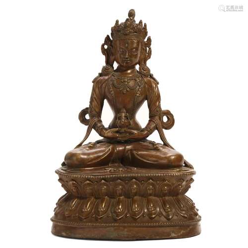 A BRONZE FIGURE OF SEATED BUDDHA