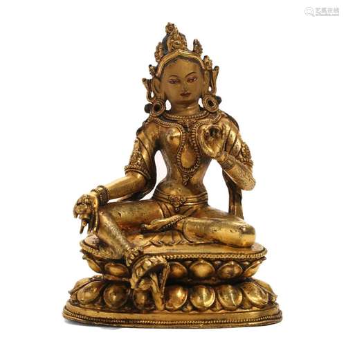 A GILT-BRONZE FIGURE OF SEATED GUANYIN