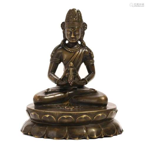 A BRONZE FIGURE OF A SEATED LAMA