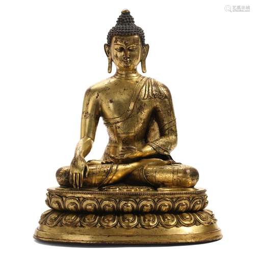 A GILT-BRONZE FIGURE OF SEATED SHAKYAMUNI