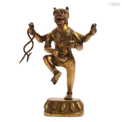 A GILT-BRONZE FIGURE OF A GUARDIAN