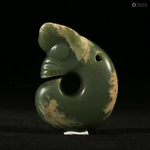 A CELADON JADE 'PIG-DRAGON' (ZHULONG)