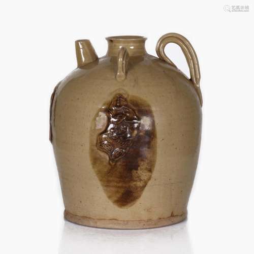 A CHINESE SOY SAUCE GLAZED LOOP-HANDLED CERAMIC WATER