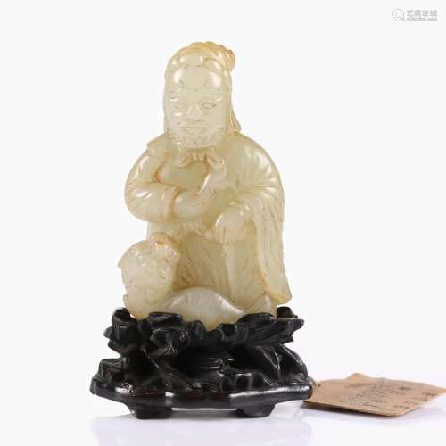 A CHINESE WHITE JADE FIGURE WITH WOOD STAND.