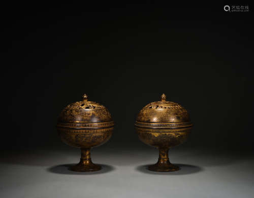 A pair of copper gilt furnaces
