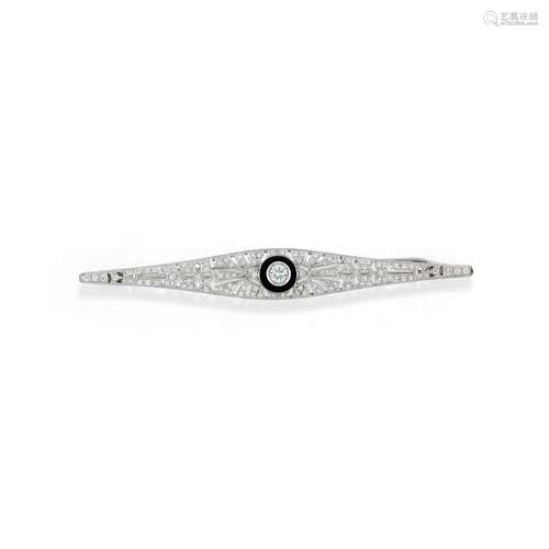 A 18K white gold, onyx and diamond brooch