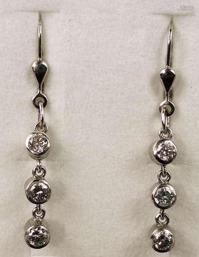 Brilliant-cut diamond earrings, each with 3 brilli…