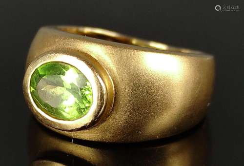 Peridot ring, wide band increasing in size towards…