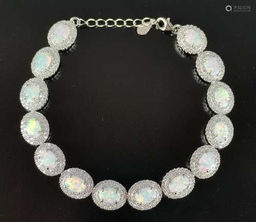 Opal bracelet, silver 925, made of 14 oval gilson …