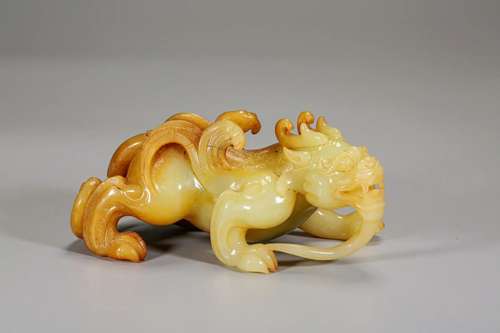 A Yellow and Russet Jade Beast Carving Han Dyn.