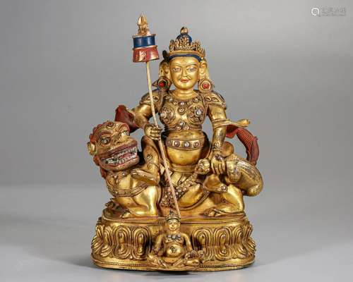 A Tibetan Bronze-gilt Seated Jambhala