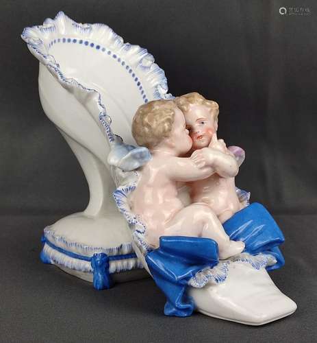 Lady's shoe as a decorative vase, with two putti a…