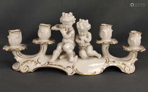 Candlestick, centered sitting music-making putti, …