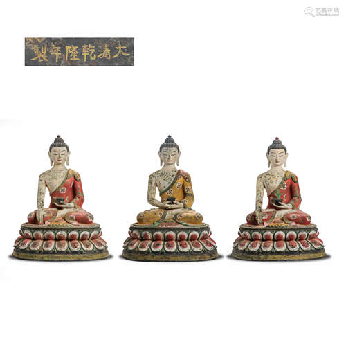 A GROUP OF PAINTED BUDDHA STATUES, QIANLONG PERIOD, QING DYN...