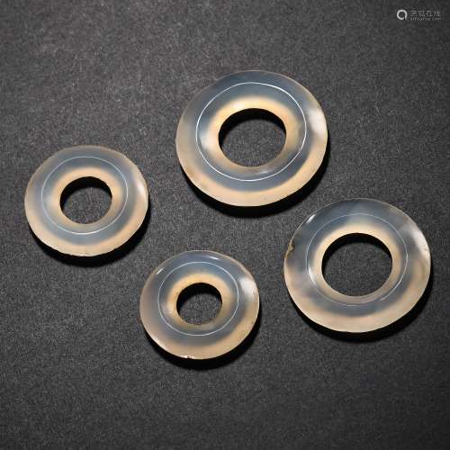 A SET OF CHINESE AGATE RINGS, WARRING STATES PERIOD