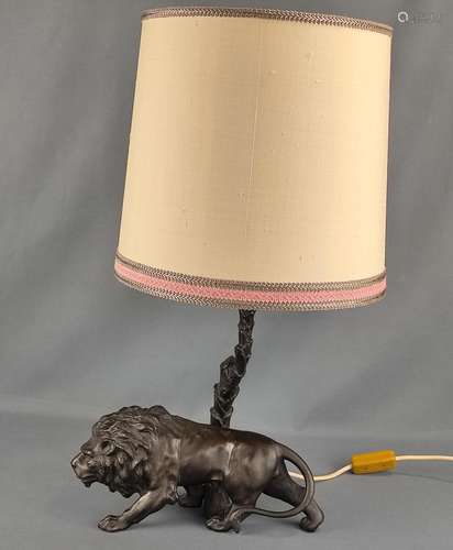 Lion table lamp, base of a sculptured lion, behind…