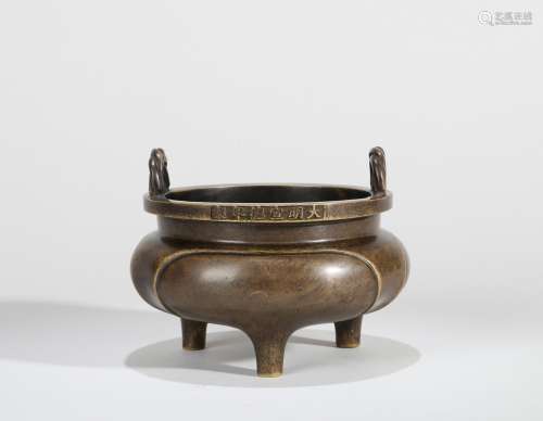 A BRONZE TRIPOD LI