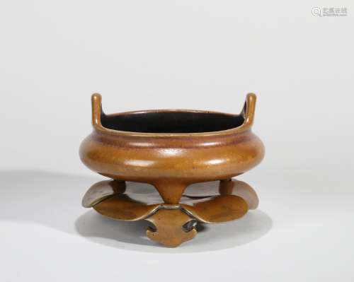 A BRONZE EARED TRIPOD CENSER WITH STAND