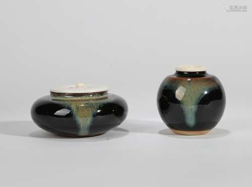 A SET OF TWO JAPANESE BLACK FLAMBE-GLAZED PORCELAIN TEA JAR