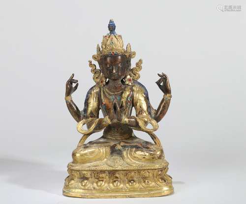 A BRONZE SEATED STATUE OF FOUR-ARMED AVALOKITESVARA