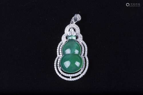 A JADEITE PENDANT OF DOUBLE-GOURD