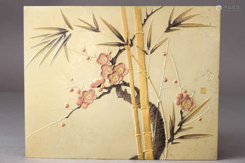 A GOLD-INLAID CARVED 'PLUM BLOSSOM AND BAMBOO' SILVER PLAQUE